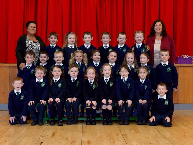 Mrs McGowan (on the right), teacher, and Mrs Cairns, classroom assistant, with their P1 class at St Patrick’s Primary School. DER2140GS – 020