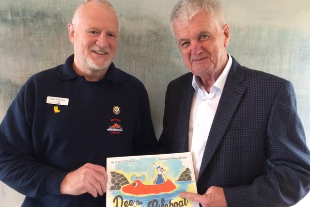 John Martin, chair of the Portrush RNLI  fundraising team, with Brian Moore, compere for the launch of Dee the Little Lifeboat