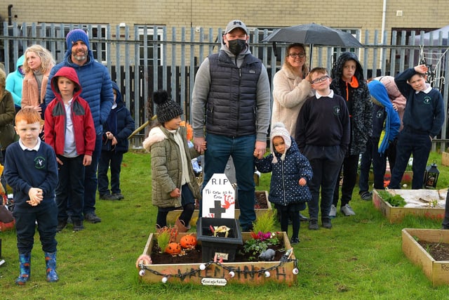 Pupils from Bunscoil Cholmcille and families pictured at the judging of the school’s Halloween plant beds competition on Monday afternoon last. DER2143GS – 038