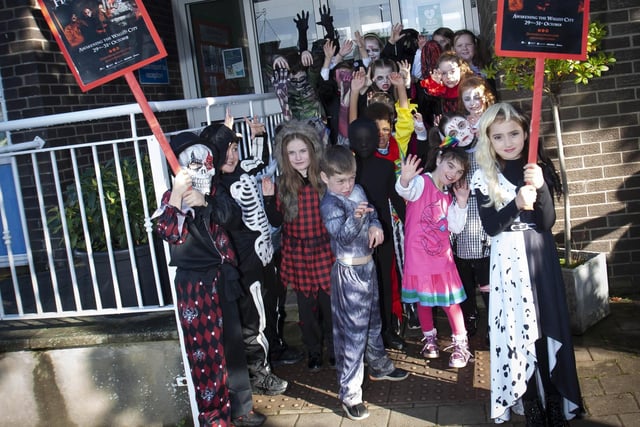 Primary 4 pupils from Greenhaw PS get ready to go on their Halloween Walkabout around Carnhill on Friday last.