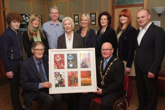 The Mayor of Derry, Councillor Kevin Campbell presenting a framed set of City of Derry Jazz Festival posters to Gay McIntyre at a reception held in the Derry City Council Offices to celebrate his 80th birthday. Included are family members, from left, Shaun, Carla, Paul, Irene, Zoe, Serena and Paul. 2905JM11