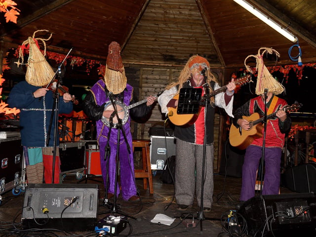 The Armagh Rhymers perform on the Samhian Bandstand, in Waterloo Place, on Halloween night. Photo: George Sweeney. DER2144GS – 019