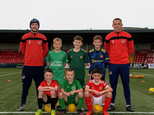 Coaches Paul McLaughlin and Jack Malone pictured with young footballers at the recent Ryan McBride Halloween Camp held at Brandywell Stadium.