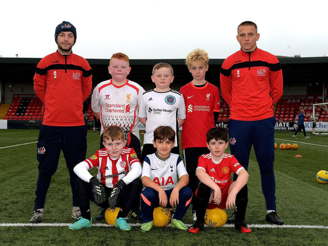 Coaches Paul McLaughlin and Jack Malone pictured with young soccer players at the recent Ryan McBride Halloween Camp held at Brandywell