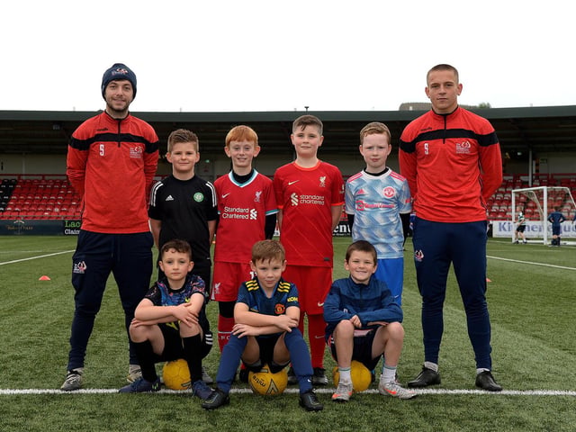 Coaches Paul McLaughlin and Jack Malone pictured with young footballers at the recent Ryan McBride Halloween Camp held at Brandywell Stadium.
