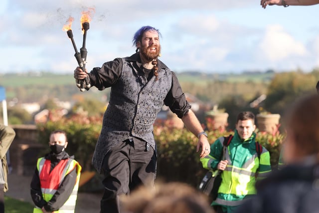 A unicylcing fire juggler at the Halloween Hoolie.
