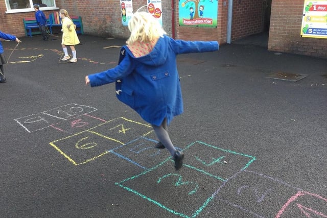 Enjoying a game of hopscotch at Macosquin Primary School as part of the Heritage Games organized by Causeway Coast and Glens Borough Council