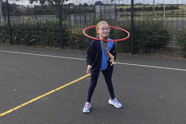 Practicing her hula-hoop technique during the Heritage Games organized by Causeway Coast and Glens Borough Council at Carnalridge Primary School, Portrush