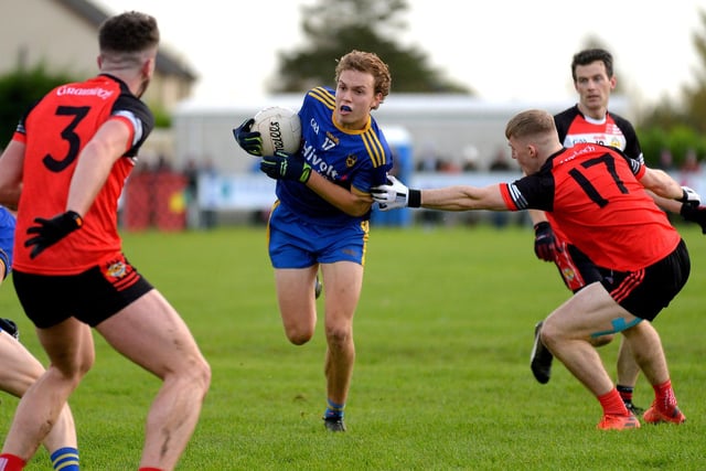 Steelstown’s Donnacha Gilmore holds possession under pressure from Greenlough’s Conor Mullan at Ballymaguigan on Saturday. (Photo: George Sweeney.) DER2144GS – 042