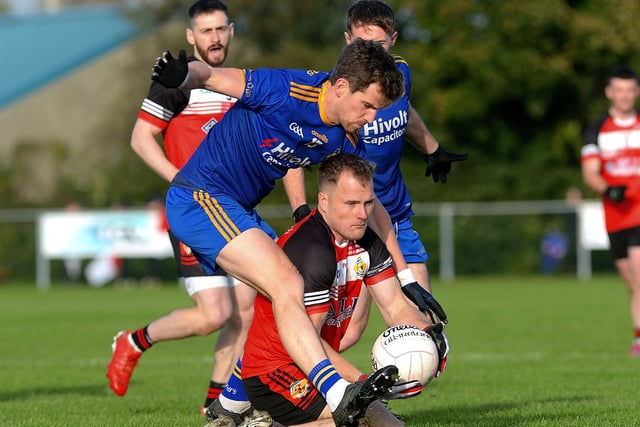 Steelstown’s Mark Foley tackles Greenlough’s Stefan Lynn at Ballymaguigan on Saturday afternoon last. (Photo: George Sweeney.) DER2144GS – 037