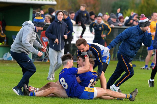 Steelstown players and supporters celebrate defeating Greenlough in the Intermediate Football Championship Final. (Photo: George Sweeney. DER2144GS – 034)