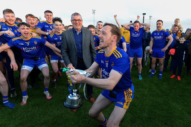 Steelstown captain Neil Forester lifts the Intermediate Football Championship trophy after defeating Greenlough. (Photo: George Sweeney. DER2144GS – 027)