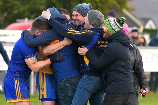 Steelstown players and coaches celebrate winning the Intermediate Football Championship on Saturday in Ballymaguigan. Photo: George Sweeney. DER2144GS – 036