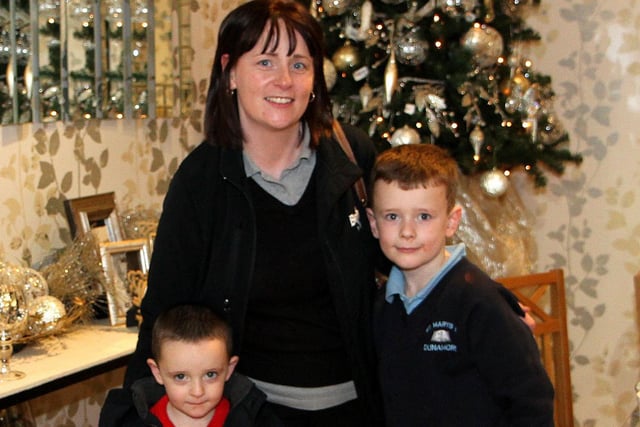 Aaron, Nathan and mum Anne Marie McKernan check out the Christmas goods at CFC Interiors Cookstown. mm46-364sr