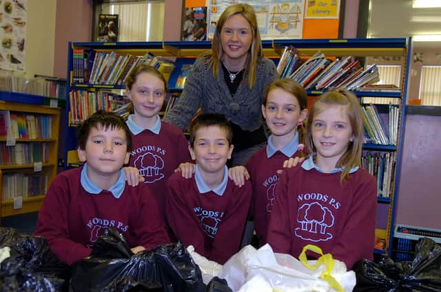 Pupils from the Woods Primary School who were doing their bit for the environment by supporting the ' Cash for Globber' scheme ran by Cookstown textile recyclers in 2007. Included in the picture is Principal Mrs. White. mm46-380sr