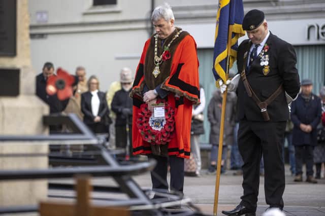 A moment of reflection for the Mayor of Causeway Coast and Glens Borough Council Councillor Richard Holmes at the War Memorial in Coleraine during an Armistice Day service held on Thursday 11th November.