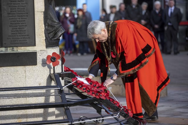 The Mayor of Causeway Coast and Glens Borough Council Councillor Richard Holmes lays a wreath at the War Memorial in Coleraine during a service to mark Armistice Day.