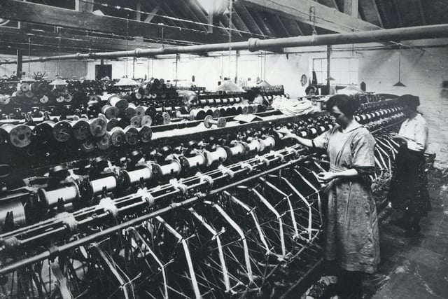 Originally the Hillsborough Woollen Co., Culcavey, in the 1870s the firm began weaving linen, and traded under the Hillsborough Linen Co. until the late 1960s. This photograph shows staff at work in the Winding Room, likely in the early 20th century.