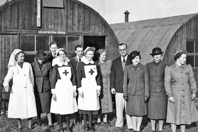 Members of the Women’s Auxiliary Services, including A.R.P, Red Cross and W.V.S., meeting at the Nissen huts in the Warren Gardens area, Lisburn, 1941