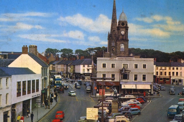 The car is king! Market Square in the 1970s looked a lot like a car park. The shopfronts of the Corner Café and Tweedy Acheson's dominated the Ulster Buildings, later Lisburn Museum.