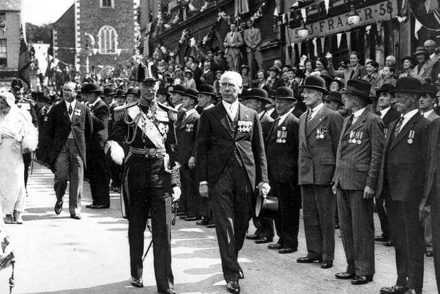 King George VI in Lisburn. As part of his coronation tour, the King inspected members of the British Legion in Market Square, 1937
