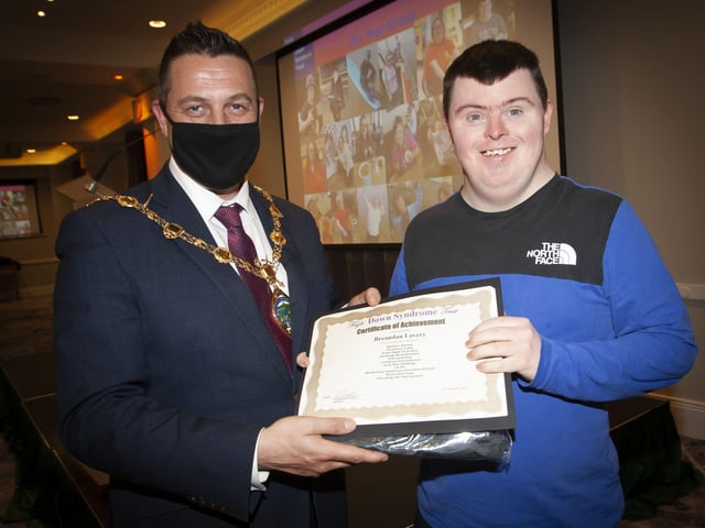 The Mayor presenting Breandan Lavery with his certificate and present at the FDST Celebration of Achievement