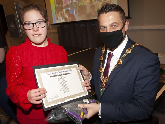 Orla Devlin receiveing her certificate and present from Mayor, Graham Warke at FDST Celebration of Achievement event.