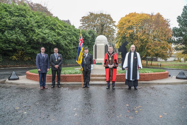 Standard bearer and clergy at Hilden War Memorial with the First Minister Paul Givan, president of Lisburn Branch Royal British Legion Raymond Corbett and The Mayor of Lisburn and Castlereagh City Council Alderman Stephen Martin