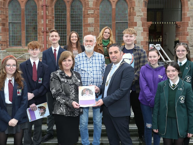 Deputy Mayor Councillor Christopher Jackson and Nichola McKee Corner with students and staff from Lisneal College, St. Cecilia’s College, and Reach Across at the launch of the writing competition in memory of Lyra McKee.