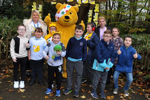 Children and staff from Ardnashee School with Pudsey Bear  at the ‘Ramble in the Woods’ at the Playtrail,for Children in Need on Thursday morning last. The event was organised by the pupil’s council. Photo: George Sweeney.  DER2145GS – 071