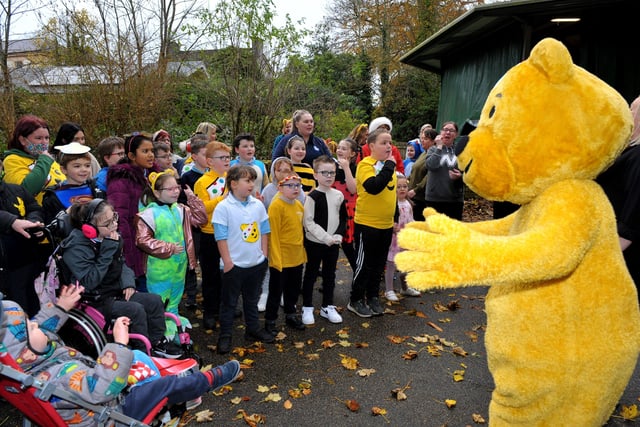 Children and staff from Ardnashee School enjoy a sing along with Pudsey Bear.
