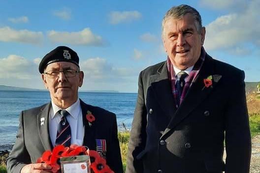Billy McIntyre pictured with Andy McGoogan during Remembrance Sunday on Rathlin Island.