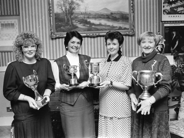 Mrs. Fidelma Doherty, captain, Redcastle Golf Club, presenting the ‘Golfer of the Year’ award to Mrs. Sylvia Huey, at an annual dinner in the Redcastle Hotel and Country Club. On right is Mrs. Elsie Owens, winner of the Redcastle Cup, and, on left, is Christine Lynch, who was runner-up.