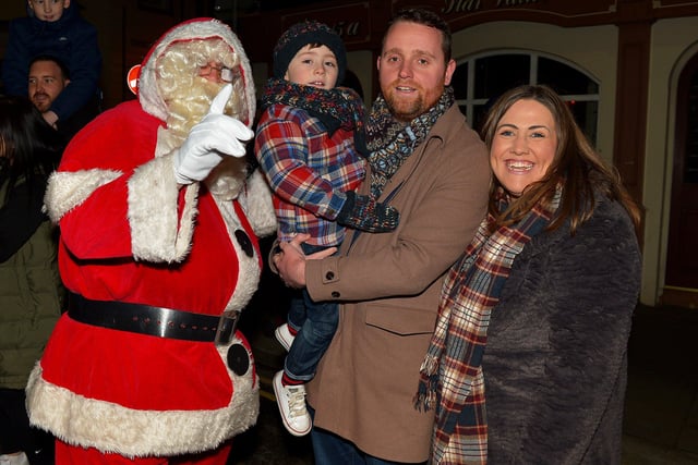Gary Middleton MLA, his wife Julie and son David pictured with Santa at the Derry Christmas Lights parade on Sunday evening last. Photo: George Sweeney.  DER2147GS – 019