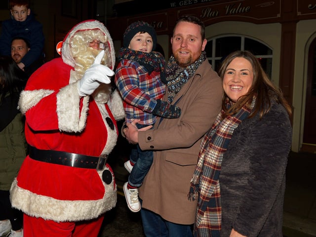 Gary Middleton MLA, his wife Julie and son David pictured with Santa at the Derry Christmas Lights parade on Sunday evening last. Photo: George Sweeney.  DER2147GS – 019