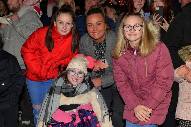 Grace, Seanain and Chloe McCallion pictured with their mum Kathleen at the Derry Christmas Lights parade on Sunday evening last. Photo: George Sweeney.  DER2147GS – 020
