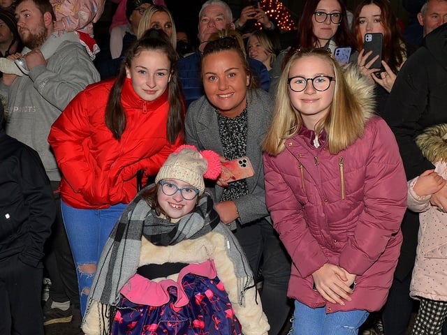 Grace, Seanain and Chloe McCallion pictured with their mum Kathleen at the Derry Christmas Lights parade on Sunday evening last. Photo: George Sweeney.  DER2147GS – 020