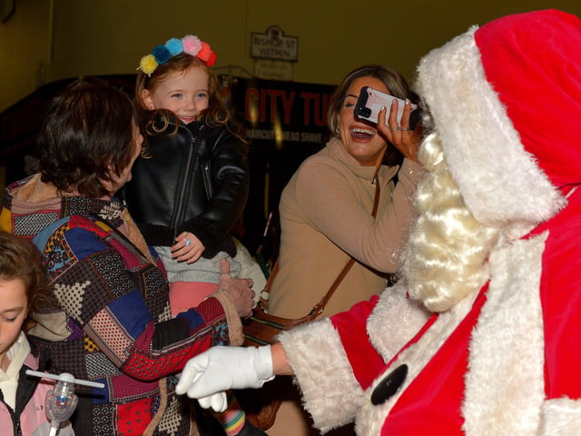 Santa greeting children at the Derry Christmas Lights parade on Sunday evening last. Photo: George Sweeney. DER2147GS – 021