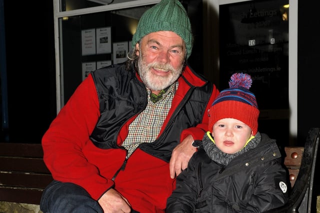 Toby Ward and his granddad George Roddy were at the switching on of the Christmas tree lights in Buncrana on Friday evening last. Photo: George Sweeney.  DER2146GS – 043