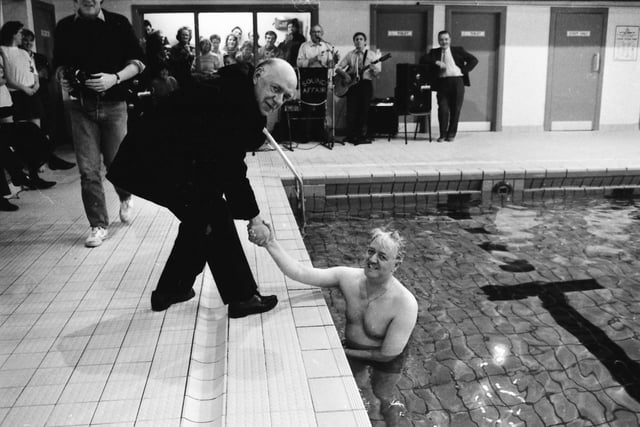 Rev. Joseph Carolan, P.P., Buncrana, congratulating Fr. Jimmy Doherty after he completed his ‘Swim Against M.S.’ in the Buncrana Leisure Centre pool.