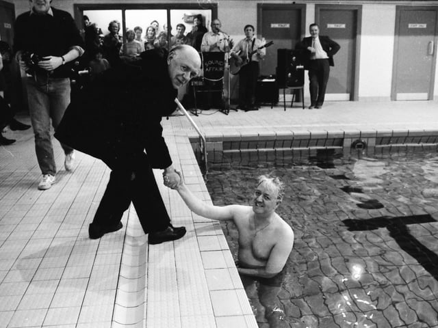 Rev. Joseph Carolan, P.P., Buncrana, congratulating Fr. Jimmy Doherty after he completed his ‘Swim Against M.S.’ in the Buncrana Leisure Centre pool.