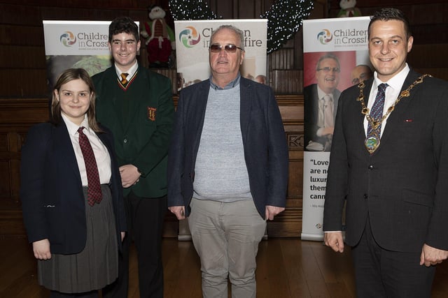 Mayor Graham Warke and Richard Moore (Children in Crossfire) with students who provided music performances at the event, soprano Caitlin McGee (Lisneal College) and pianist James O'Brien, St. Mary's High School, Limavady, at an event to mark the 25th anniversary of Children in Crossfire, held in the Guildhall.  (Photo - Tom Heaney, nwpresspics)