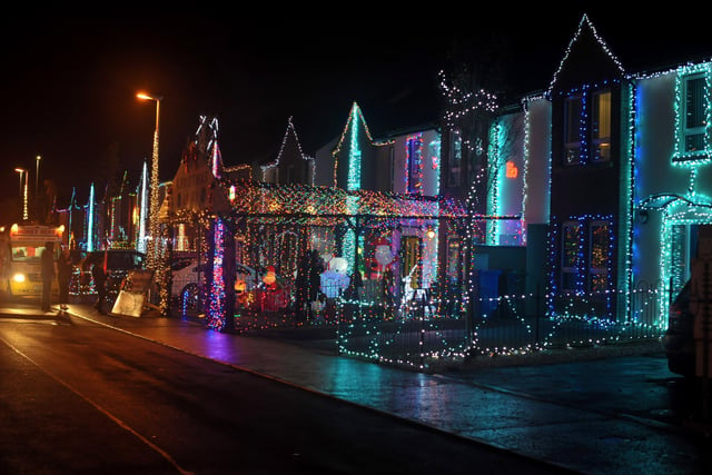 Christmas decorations adorn houses in Racecourse Drive. DER2146GS – 011