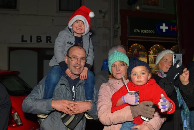 Families gather for the switching on of the Christmas tree lights in Moville on Sunday evening last. Photo: George Sweeney.  DER2148GS – 003