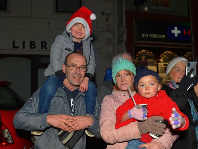 Families gather for the switching on of the Christmas tree lights in Moville on Sunday evening last. Photo: George Sweeney. DER2148GS – 003