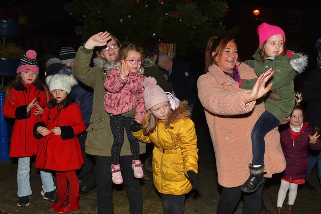 Waiting for Santa to arrive for the switching on of the Christmas tree lights in Moville on Sunday evening last. Photo: George Sweeney.  DER2148GS – 005