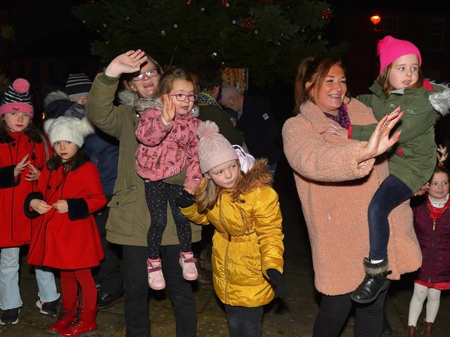 Waiting for Santa to arrive for the switching on of the Christmas tree lights in Moville on Sunday evening last. Photo: George Sweeney. DER2148GS – 005
