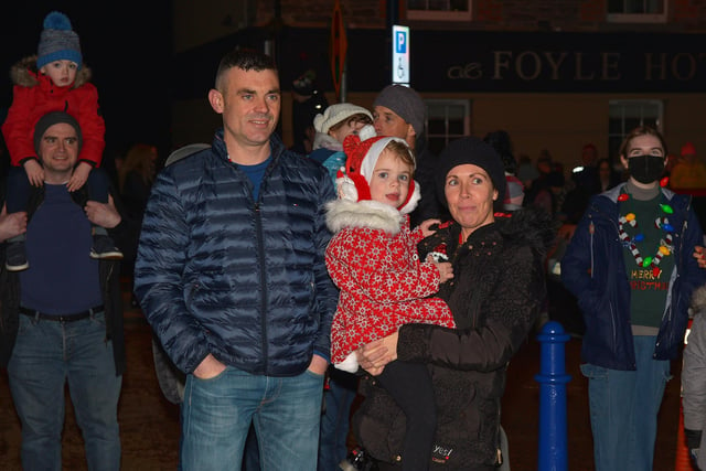 Families gather for the switching on of the Christmas tree lights in Moville on Sunday evening last. Photo: George Sweeney.  DER2148GS – 006
