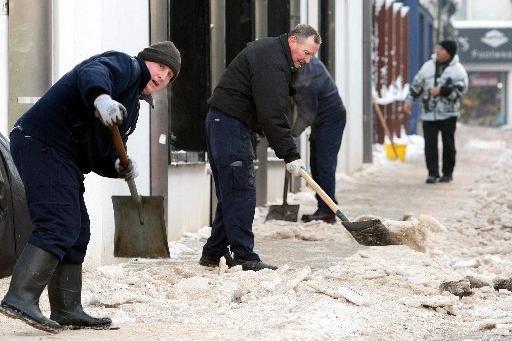 Council workers shovel snow on the streets of Ballymena in 2010.