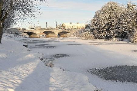 A snow-covered frozen River Bann in Portadown.
